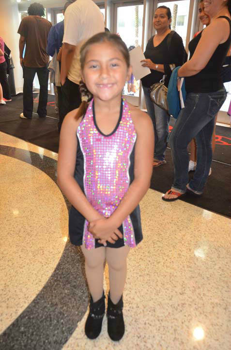 Two young dancers are lined up to audition for...